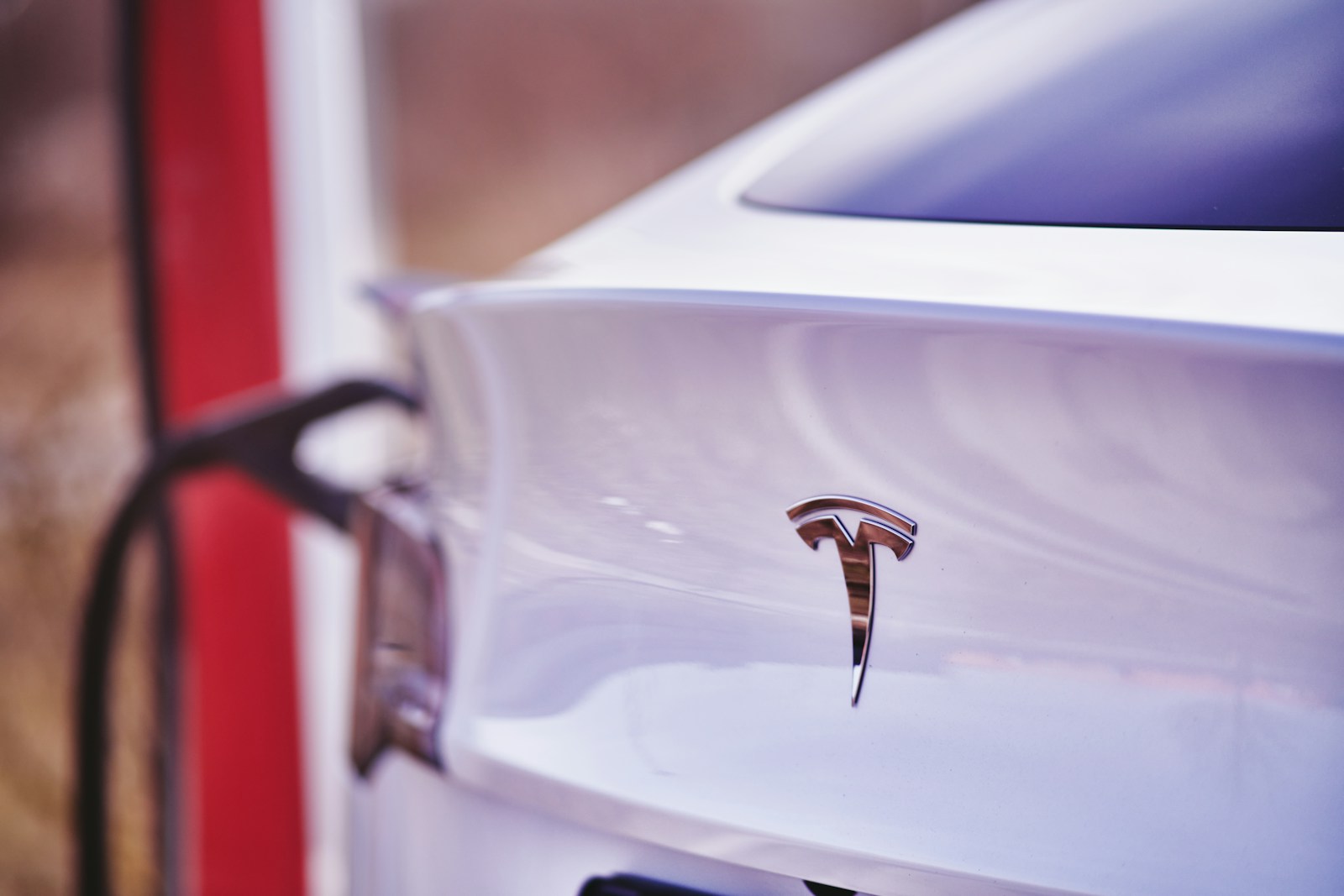 a close up of a white car with a red stripe